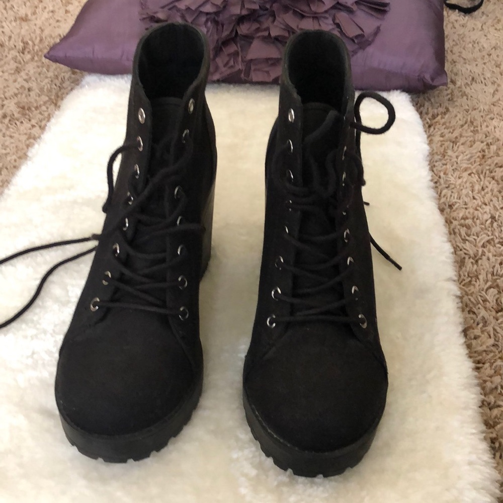 Heeled black lace up boots